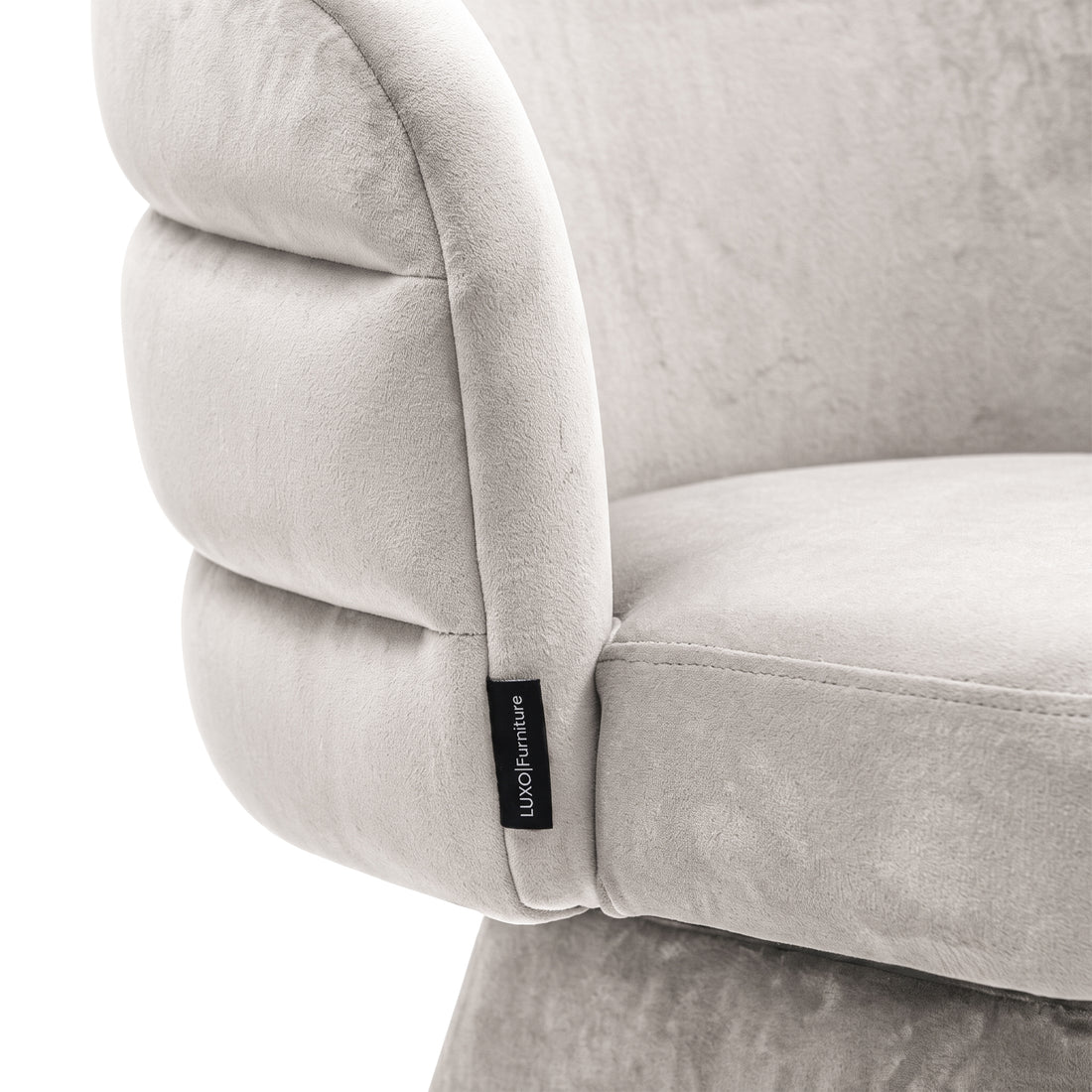 Close-up of the grey swivel dining chair showing its smooth fabric texture and stitched channel-back design.