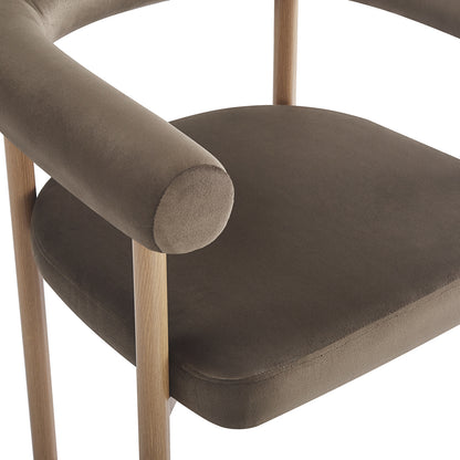 Close-up of Ohio Velvet Dining Chair w/ Natural Legs Espresso Brown Set of 2, showcasing muted brown padded seat, tubular backrest, and light-finished wood frame, highlighting luxurious velvet upholstery and oak-look metal frame.