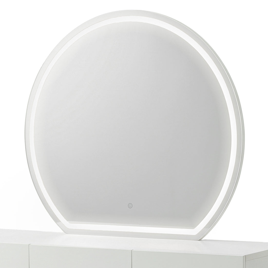 Modern round makeup mirror with an illuminated white frosted border on a white console table.