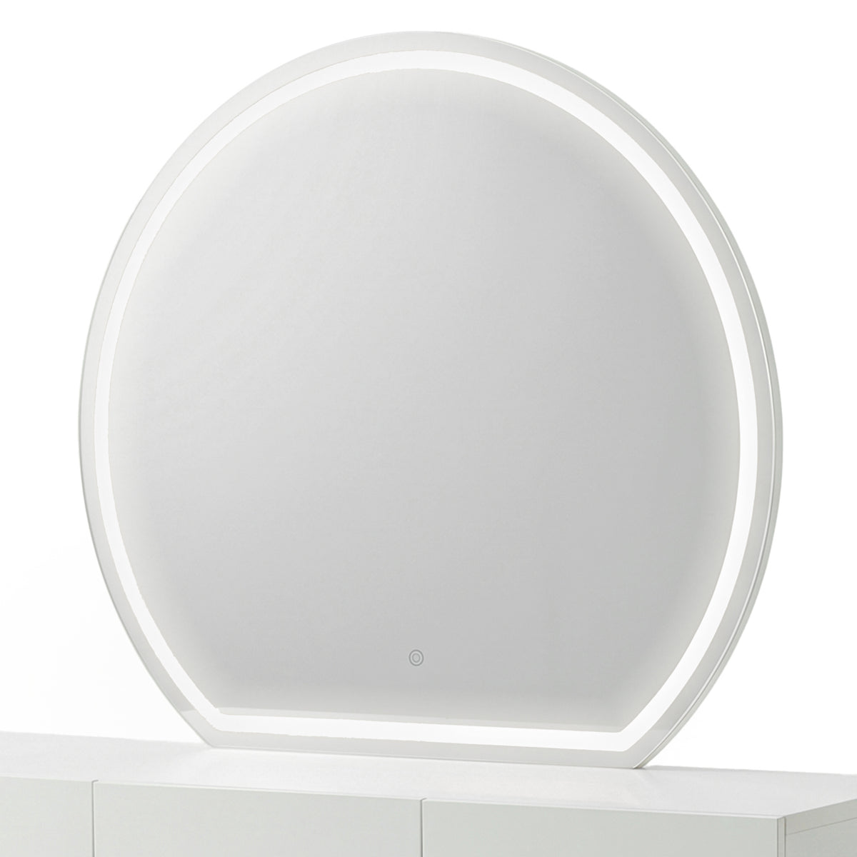 Modern round makeup mirror with an illuminated white frosted border on a white console table.