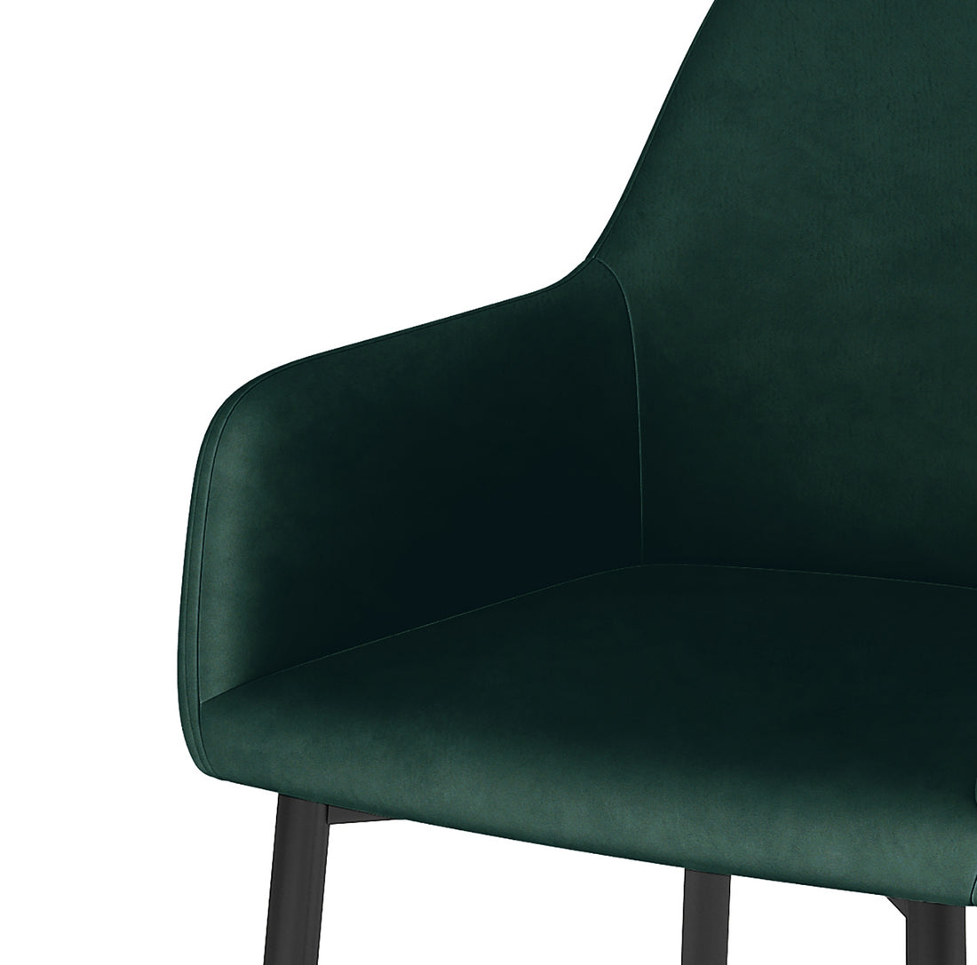 Raynie Velvet Dining Chair Set of 2 in Deep Green, featuring a modern design with a softly curved back, integrated armrests, plush velvet upholstery, and slim, dark metal legs for elegant dining room style.