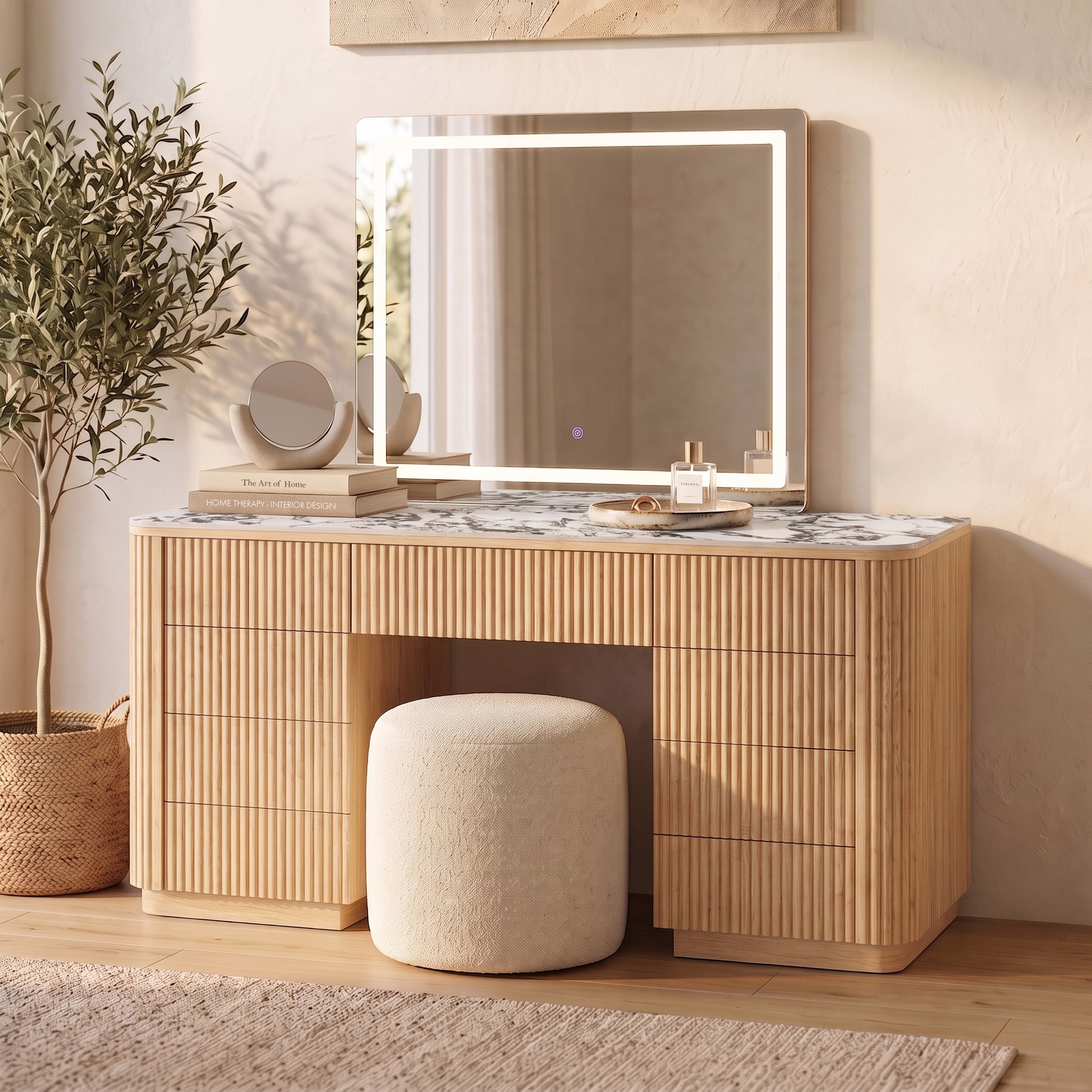 Natural fluted wood vanity with marble-look top, LED mirror, storage drawers and cream boucle stool in sunlit room