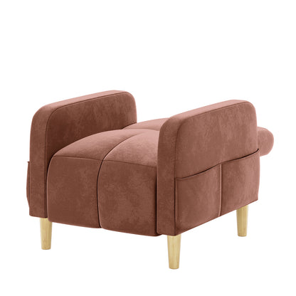 Anica Single Seater Velvet Fabric Sofa Chair in Blush: A modern, low-profile chair with rust-brown suede-like upholstery, rounded arm panels, side pockets, and short tapered wooden legs, offering stylish functionality.