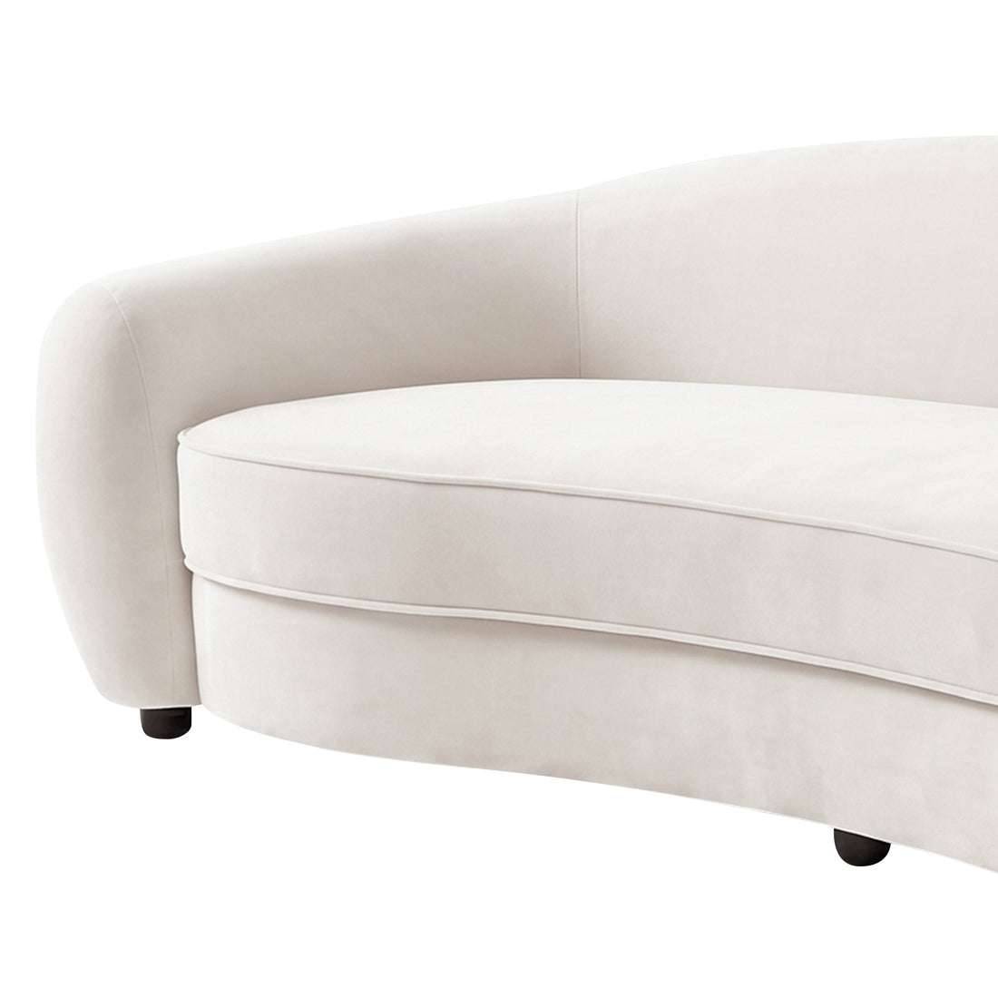 Close-up of curved cream white velvet sofa with rounded armrest, upholstered seat cushion, and black legs on white background