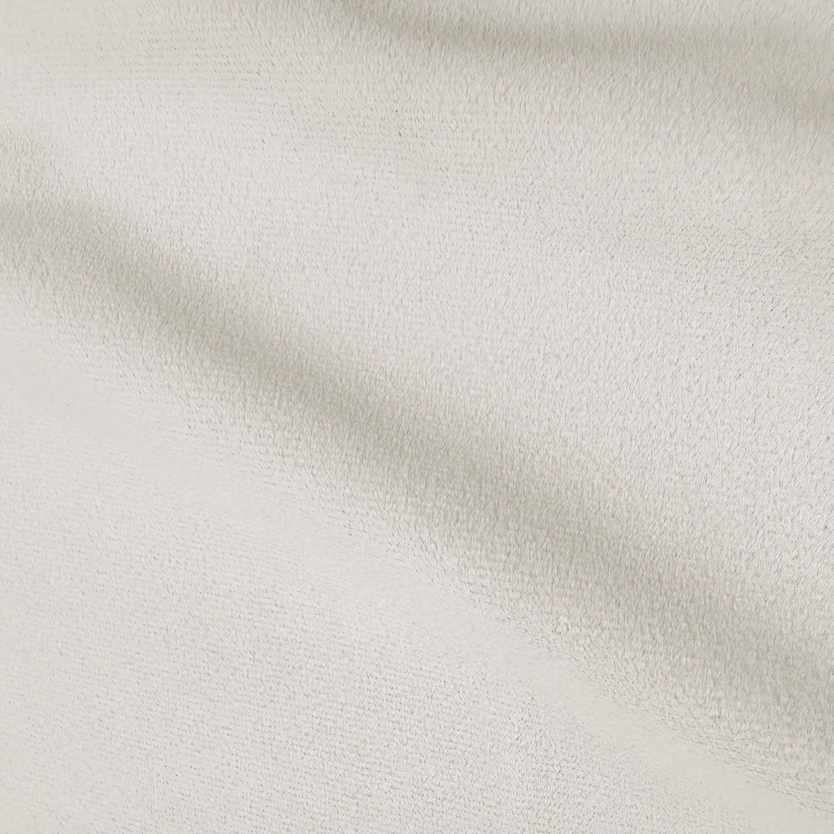 Close-up of cream white velvet upholstery showing soft texture and subtle sheen