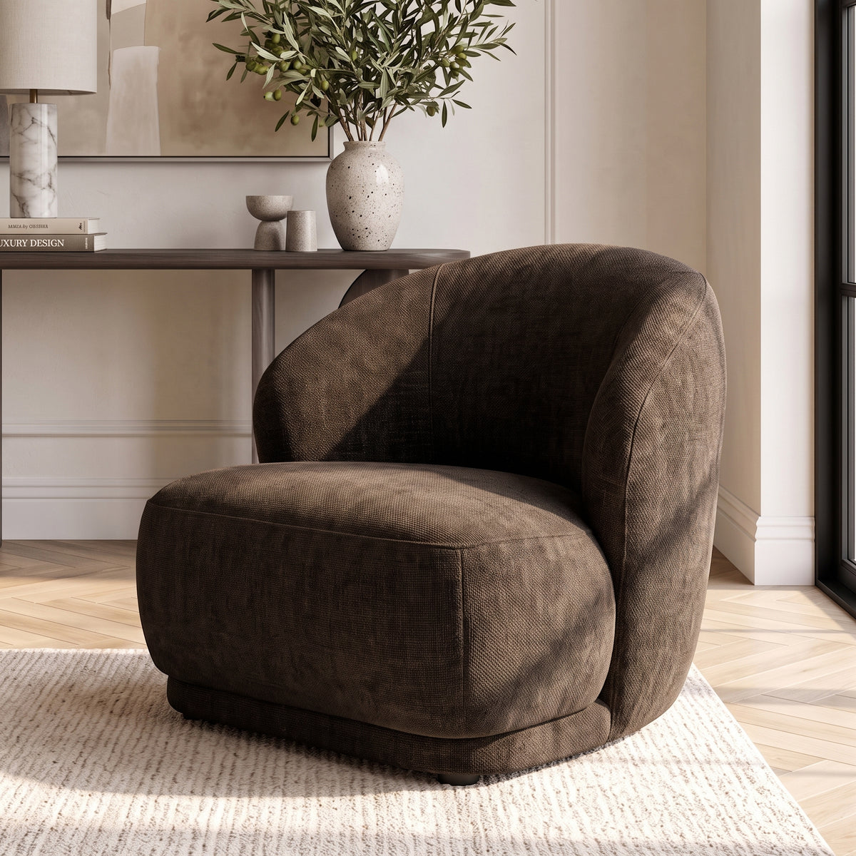 Cocoa brown accent chair placed in a stylish room with decor and a rug.