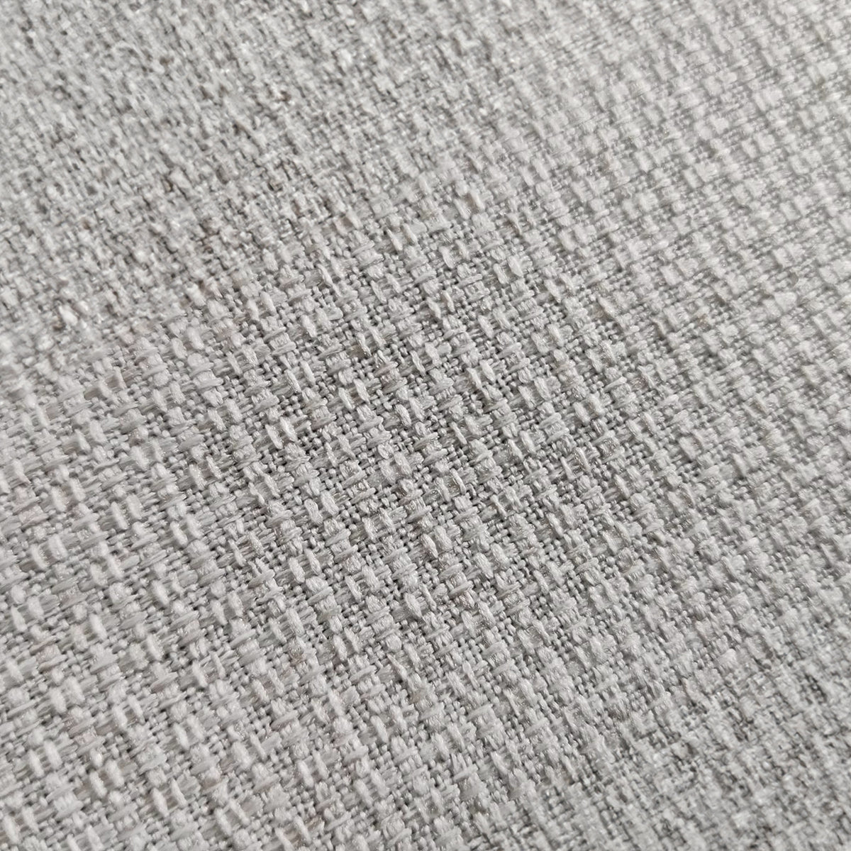 Close-up of the Celeste 3 Seater Hardwood Fabric Sofa, showcasing its textured fabric surface and sturdy frame, highlighting its blend of style and durability.