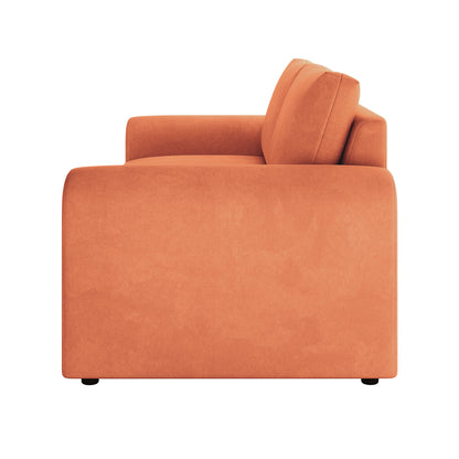 Side view of Celyn 3 seater sofa in burnt orange velvet upholstery with rounded armrest and black feet
