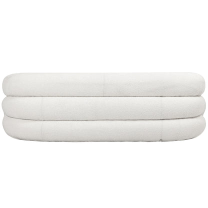 Clioz 3 Seater Curved Boucle Sofa in Eggshell White features a low, oval shape with a stacked, rounded silhouette, upholstered in textured off-white bouclé fabric.