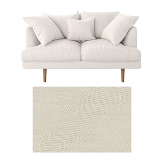 Colton 2 Seater Fabric Sofa with Rug - Cream White features a mid-century modern loveseat with exposed wood legs and loose cushions, paired with a tufted beige rectangular rug below.