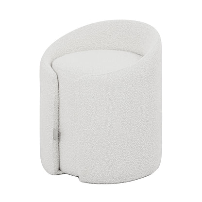 A minimalist, cream-colored bouclé ottoman stool with a soft, curved silhouette and a compact design.