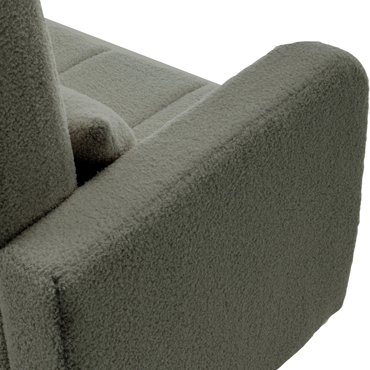 Close-up of the Gamila Boucle Rocking Chair with Ottoman in Green, showcasing the corner with an armrest and part of the seat/back cushions in looped bouclé fabric.