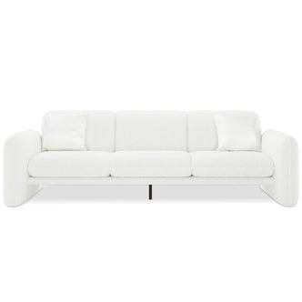 Ivano 4 seater boucle upholstered sofa in cream white with curved armrests, three seat cushions, and black metal centre leg
