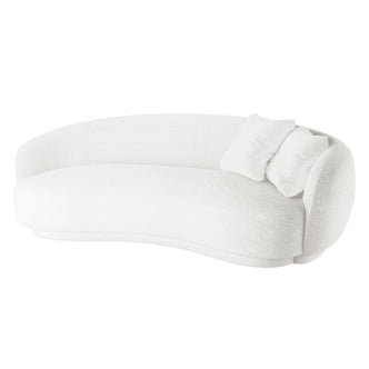 White bouclé curved sofa with matching scatter cushions and a rounded silhouette against a plain white studio background.