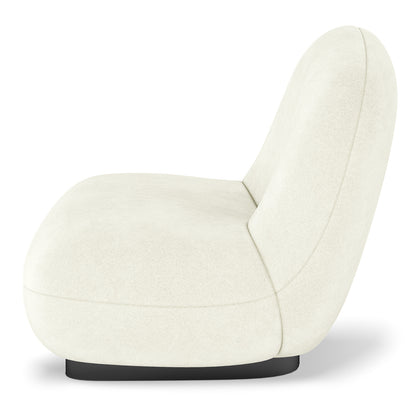 Cream swivel accent chair with curved backrest, rounded seat and black base, side view