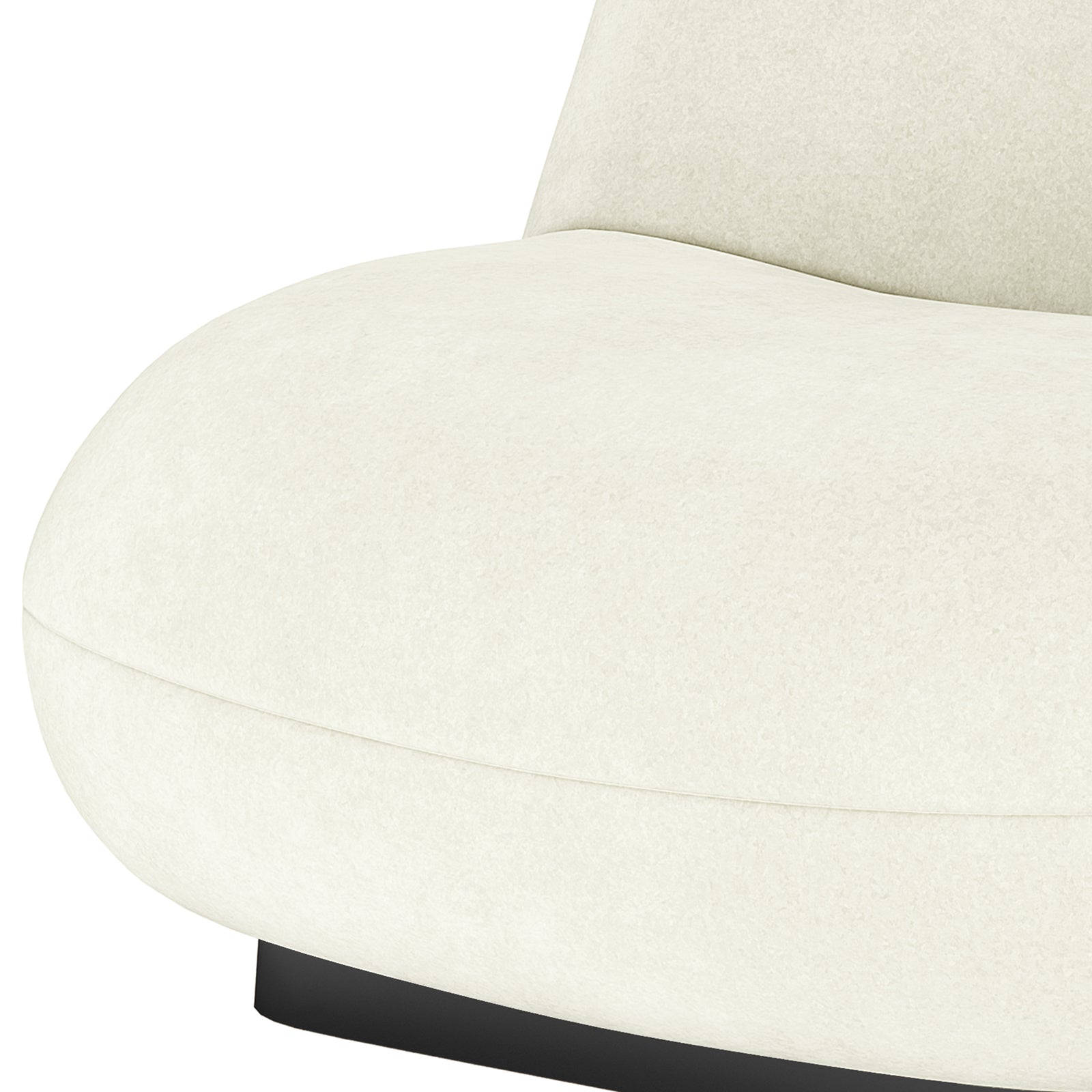 Close-up of cream velvet swivel accent chair seat with curved edges and black base