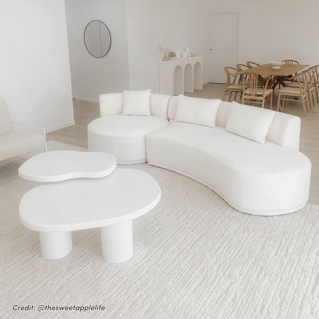 Lyana 4 Seater Boucle Sofa with Right Chaise in Cream White, curved design with matching throw pillows and sculptural white