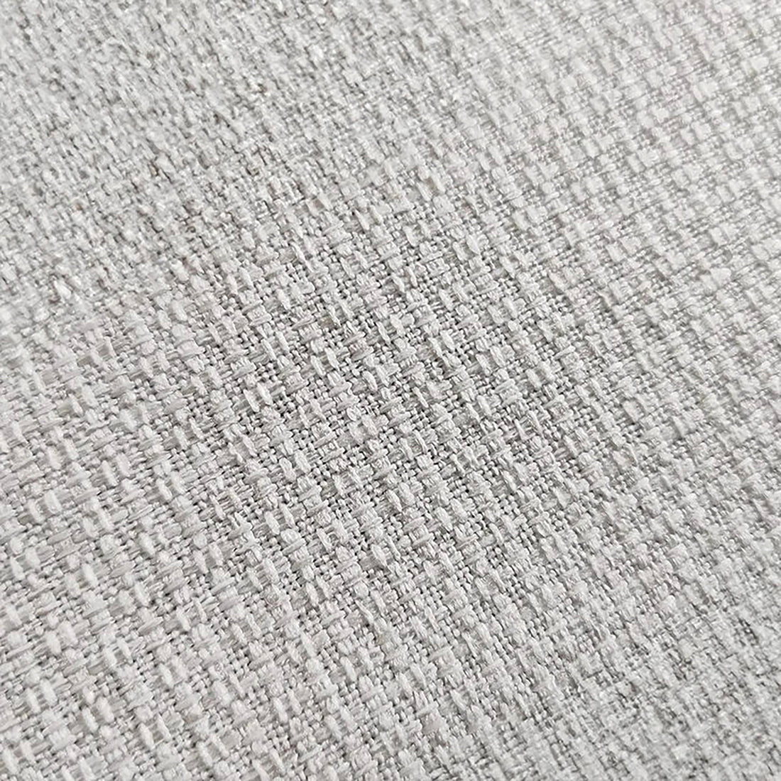 Millie 4-Seater Fabric Corner Chaise Sofa features a close-up of its premium woven linen fabric surface, showcasing the plush, textured appearance integral to its inviting design.