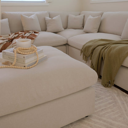 Millie 6-Seater Fabric Corner Chaise Sofa with plush, thick cushions on a modular design, showcasing its versatility and comfort on a couch setting, ideal for spacious, stylish living areas.
