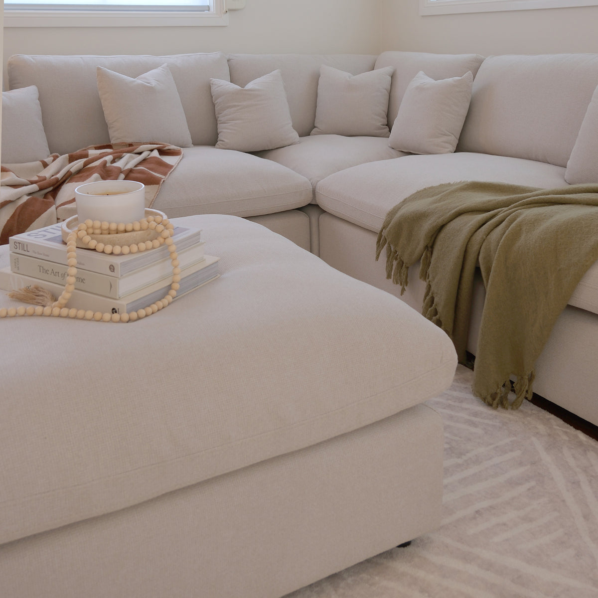 Close-up of the Millie 6-Seater Fabric Corner Chaise Sofa, showcasing plush cushions and modular design, emphasizing comfort and style for any living space.