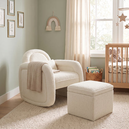 Cream white bouclé rocking chair with matching ottoman in nursery setting