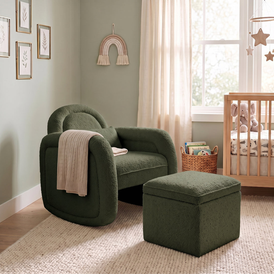 Dark forest green bouclé rocking chair with matching storage ottoman in nursery setting