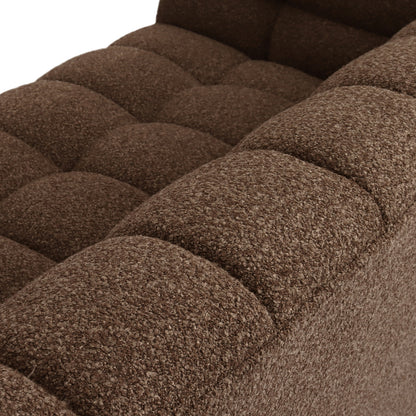 Close-up of the Norah 3 Seater Boucle Sofa in Brown, showcasing its tufted seat and back cushions with padded, quilted squares and a looped, nubby texture upholstery.
