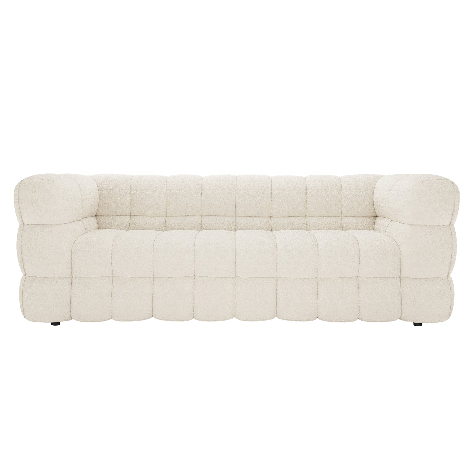 Norah 3 Seater Boucle Sofa in Cream White features a low-profile design with chunky, deeply tufted cushions. Its quilt-like bouclé upholstery enhances comfort and elegance, ideal for modern interiors.