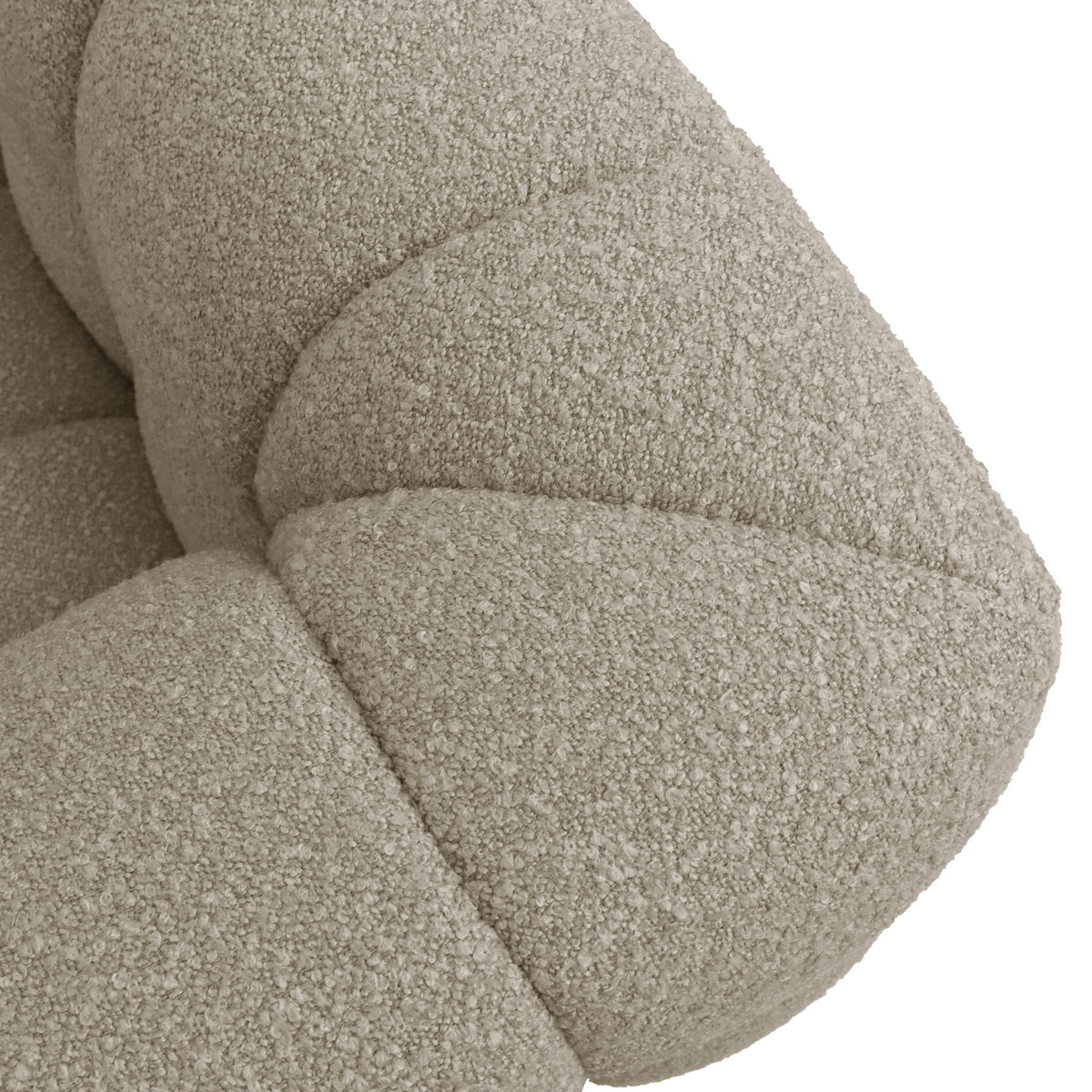 Norah 3 Seater Boucle Sofa in Warm Beige, showcasing close-up of cream-beige boucle fabric with visible tufted, padded segments. The textured looped upholstery highlights the sofa's contemporary, inviting aesthetic.