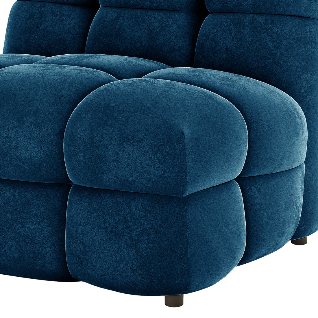 Close-up of the Norah 5 Seater Velvet Sofa Set with Ottoman in Blue, showcasing its tufted, cushiony seat and back panels, deep blue velvet-like upholstery, and a short, round black leg.