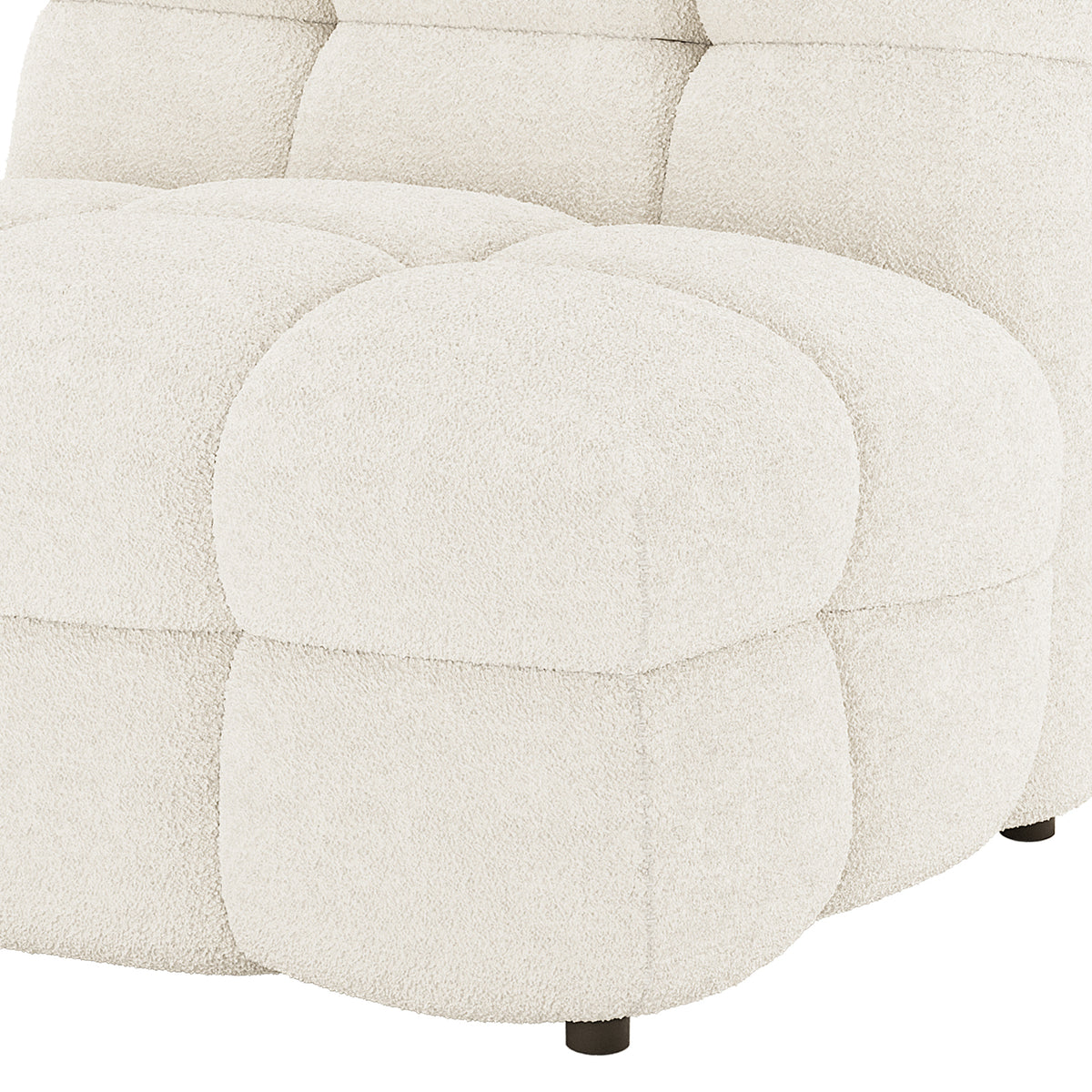 Close-up of Norah 5 Seater Bouclé Sofa Set with Ottoman in Cream White showing chunky tufted cushions, cream-white bouclé fabric, and a low, dark wooden leg.