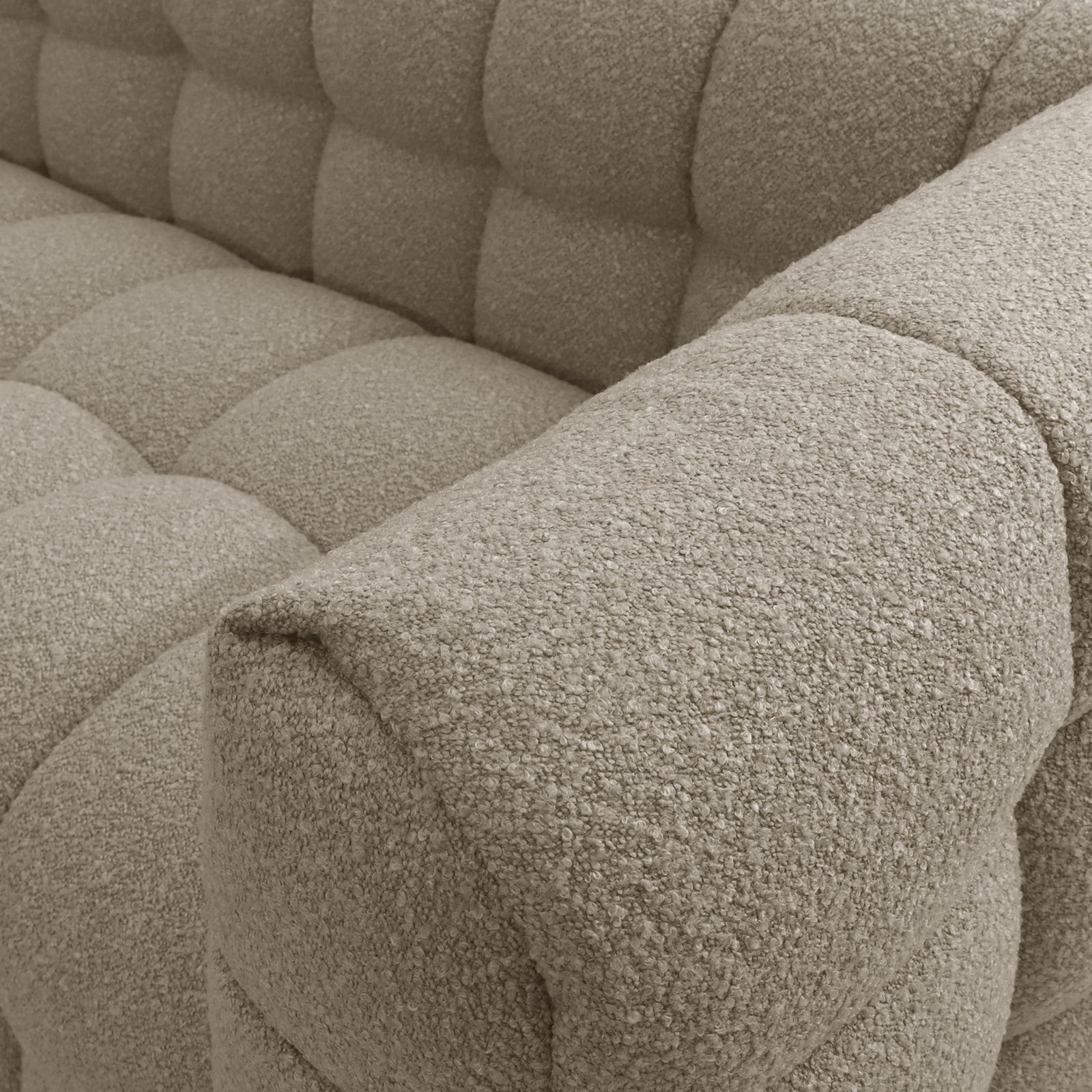 Norah 5 Seater Boucle Sofa Set With Ottoman in Warm Beige, showcasing tufted, nubby boucle upholstery with oversized quilted squares on the seat, back, and arms, exuding elegance and comfort.