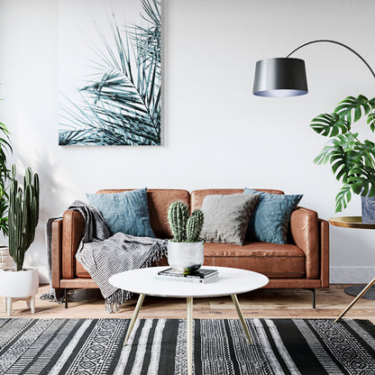 Oslo 3 Seater PU Leather Sofa Brown with sleek PU leather upholstery, sturdy metal legs, and plush cushions, set as the focal point in a modern living room, enhancing its contemporary aesthetic.