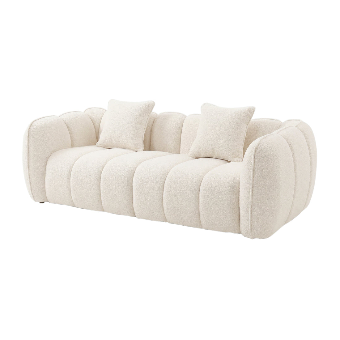 Modern cream-colored sofa with rounded segmented cushions and two matching throw pillows on a white background