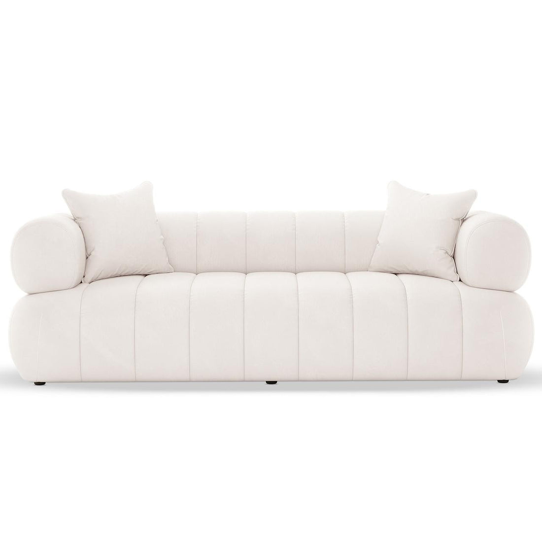 Samira 3 Seater Velvet Sofa in Cream with a modern, rounded design features vertical channel tufting, cylindrical bolster armrests, and matching throw pillows, offering plush comfort in a durable timber frame.