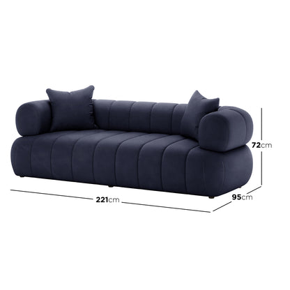 Samira 3 Seater Velvet Sofa in Navy Blue, showcasing its plush velvet texture, sleek silhouette, and accompanying matching pillows, designed for modern elegance and comfort in a living space.