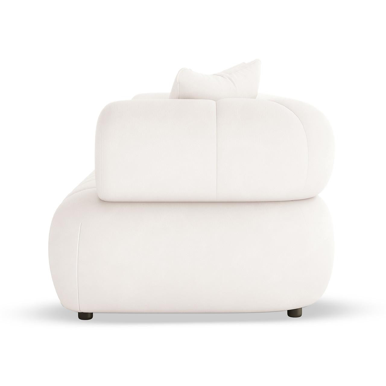 Samira 5 Seater Velvet Sofa Set in Cream showcases a modern, oversized design with soft, rounded edges, solid white upholstery, and short black feet, featuring a plush cushion and loose pillow.
