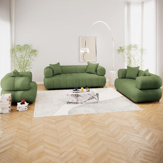 Samira 6 Seater Velvet Sofa Set Prasinous Green displayed in a stylish interior with a green couch, accented by plush pillows and a sleek lamp, exemplifying modern elegance and comfort.