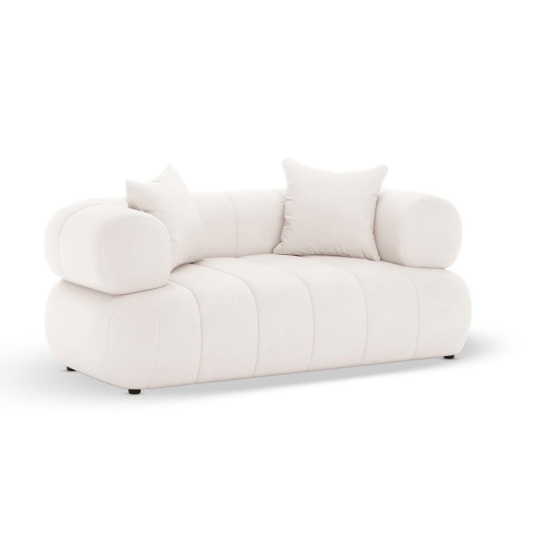 Samira 2 Seater Velvet Lounge in Cream features a low-profile, blobby silhouette with rounded arms, vertical channel tufting, and includes two matching throw pillows and bolster-style arm cushions.