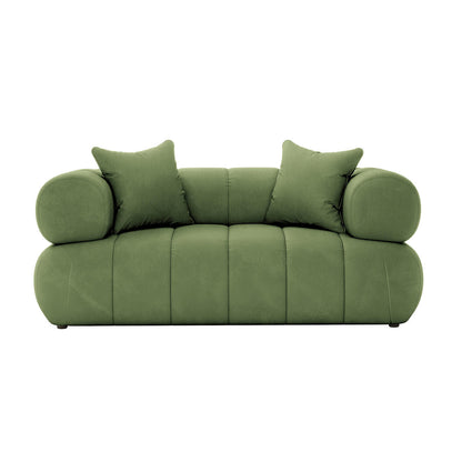 Samira 2 Seater Velvet Lounge in Prasinous Green features a modern, low-profile design with tubular armrests, panel-style tufting, and two matching throw pillows, offering both elegance and comfort.