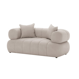Samira 2 Seater Velvet Sofa - Warm Beige, close-up view showcasing its plush velvet texture, elegant design, and accompanying matching pillows, highlighting the luxurious and contemporary appeal of this compact seating piece.
