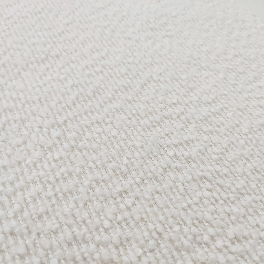 Seto Bouclé Curved Occasional Accent Chair in eggshell white, featuring a soft, loop-pile bouclé fabric with a nubbly texture, highlighting its curved backrest and plush design for stylish comfort.