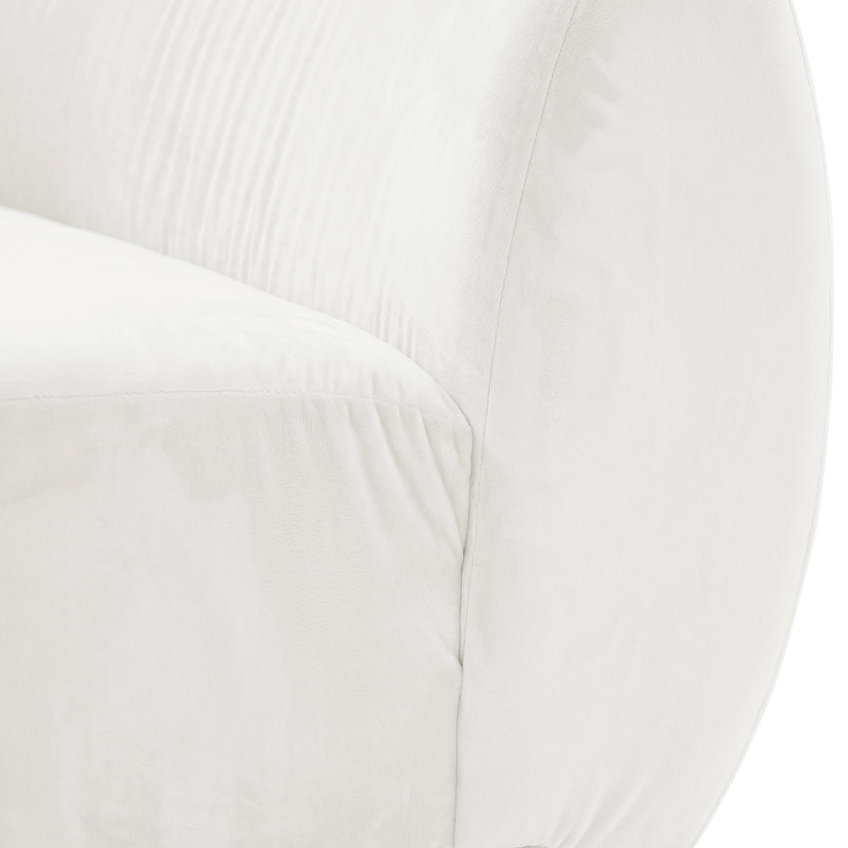 Close-up of cream white velvet upholstery showing curved seam detail and soft texture