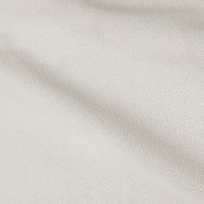 Cream white curved velvet sofa texture detail showing soft plush fabric