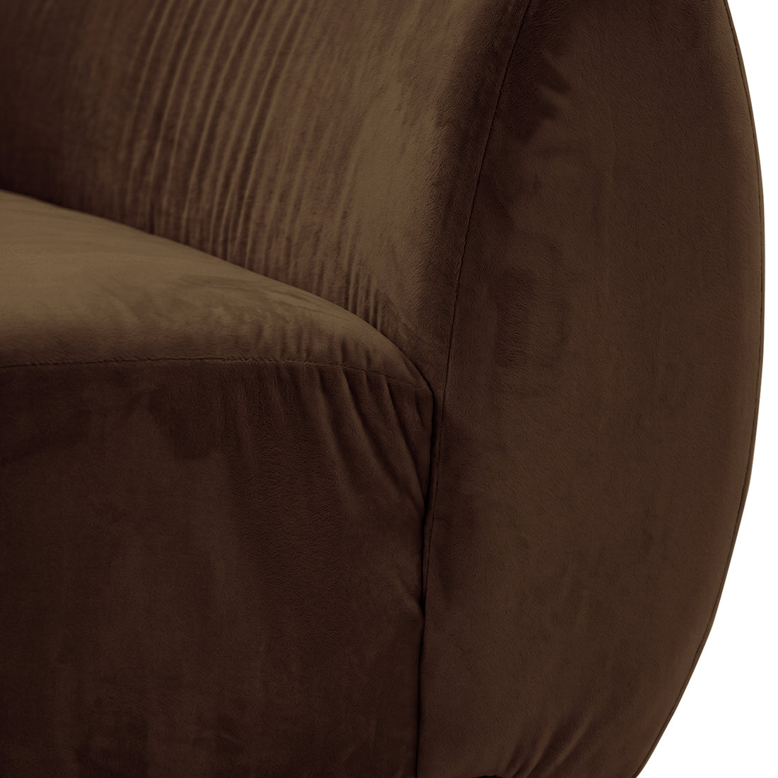 Close-up of curved modular sofa in warm taupe brown velvet showing cushion seam detail