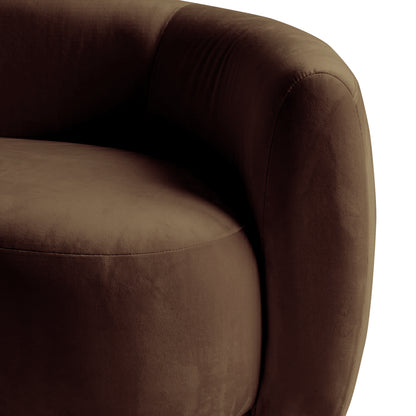 Close-up of curved velvet sofa arm and seat in warm taupe brown with visible stitching detail on white background