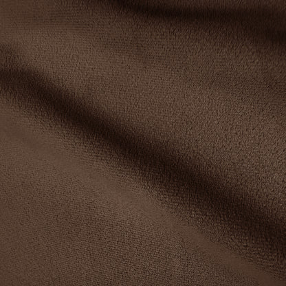 Close-up of warm taupe brown velvet upholstery texture showing soft pile and subtle shading