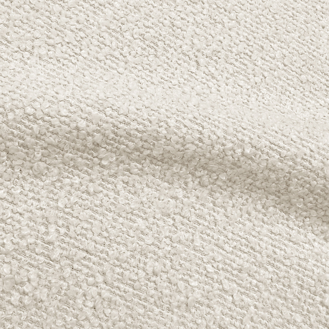 Close-up of cream white boucle fabric texture showing woven looped fibres