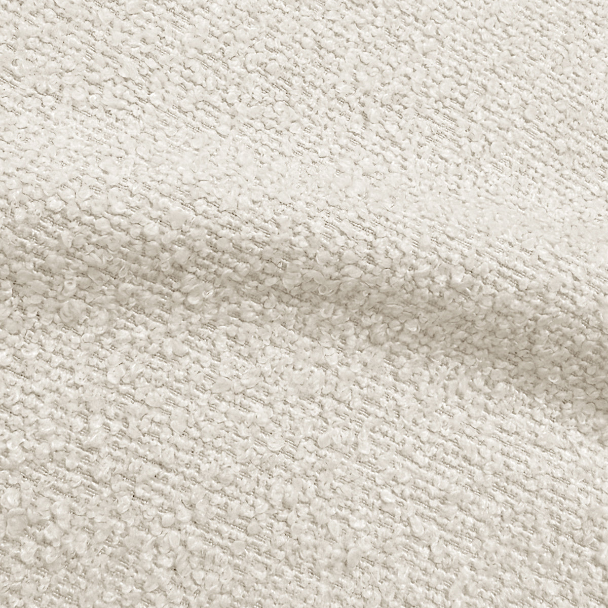 Close-up of cream white boucle fabric texture showing woven looped fibres