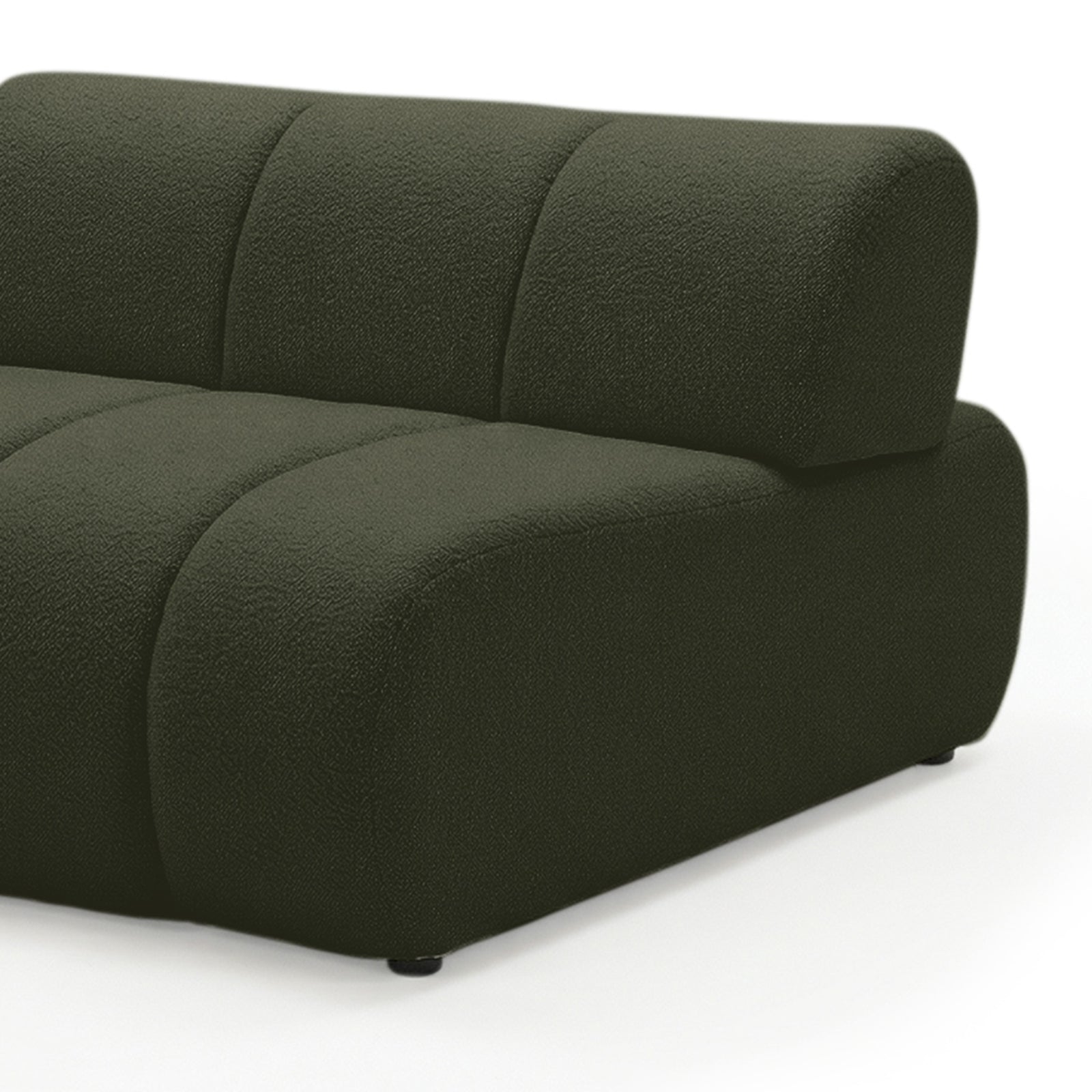 Close-up of curved modular sofa arm and backrest in dark forest green boucle fabric on white background